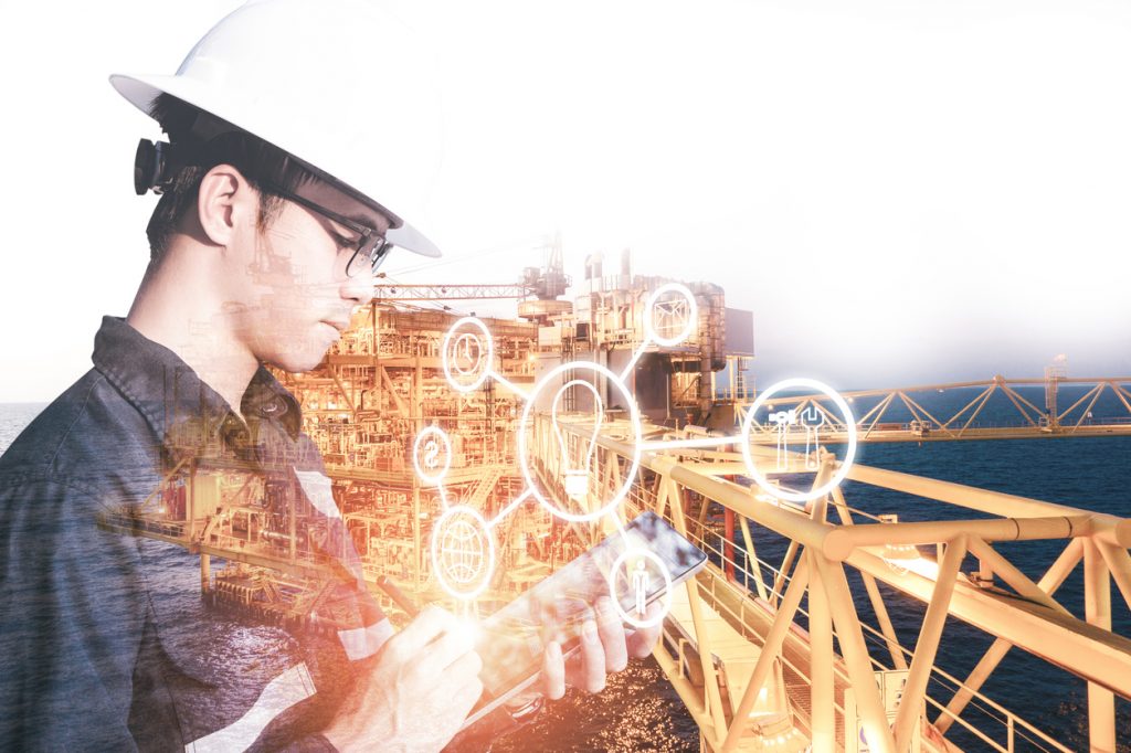 Double exposure of Engineer or Technician man with industry tool icons for management business by using tablet with safty helmet & uniform for oil and gas industrial business concept.