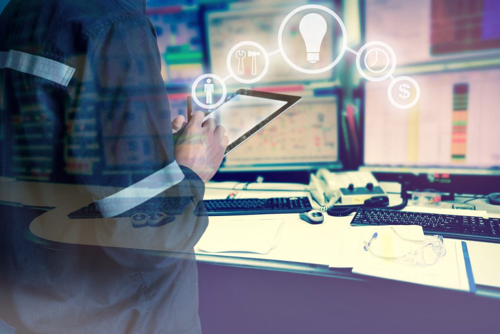 Double exposure of Engineer or Technician man with business industrial tool icons while using tablet with monitor of computers room for oil and gas industrial business concept.