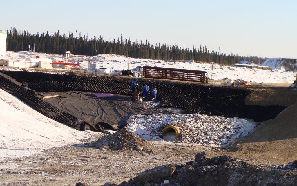 Christina Lake in Alberta is rich with oil so deep underground that specialized technology is required to drill and pump it to the surface.  As part of the oil extraction at this site operated by Cenovus Energy, a 21,000 cubic meter capacity process pond was planned to contain the process water. Original Design The process pond original design included a protective cover system on the 3H:1V slopes with an emulsified asphalt layer over a Tensar BX geogrid.  However, questions related to technical feasibility and expense made the client and their engineer look for alternatives. 