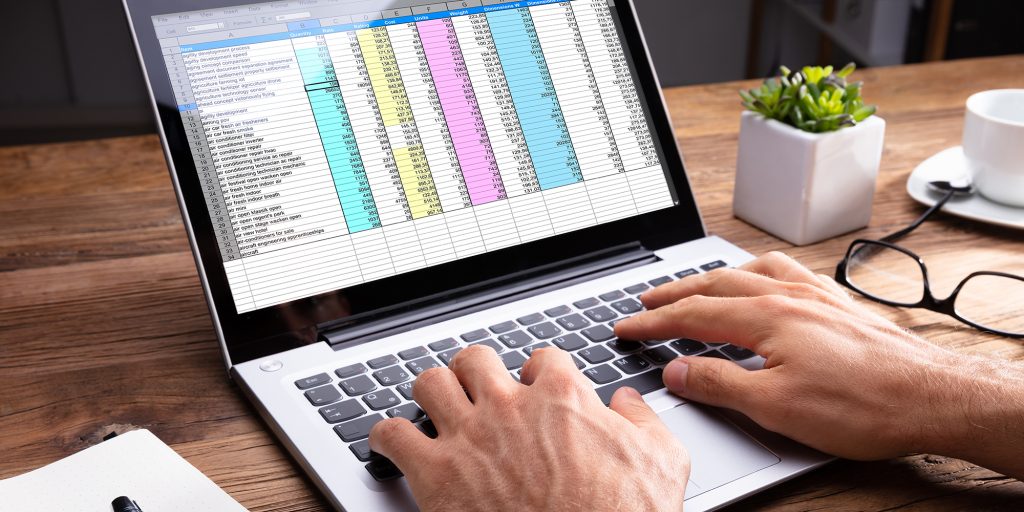 person's hand using laptop