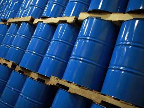 global oil market faces a million barrel glut next year, says iea oil drums barrels of oil 2