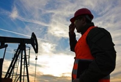 oilfield worker by pumpjack 400x270