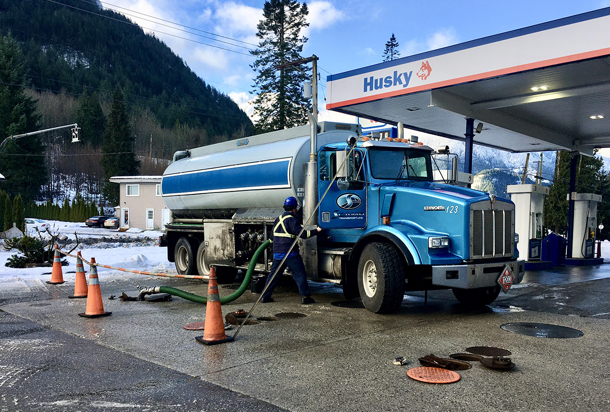 fuel truck refills holding tanks at a gas station in british columbia 1200x810