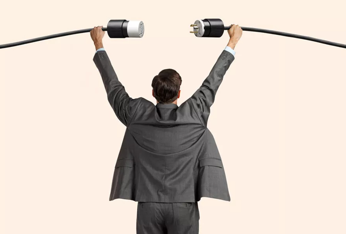 man holding plug extension cord