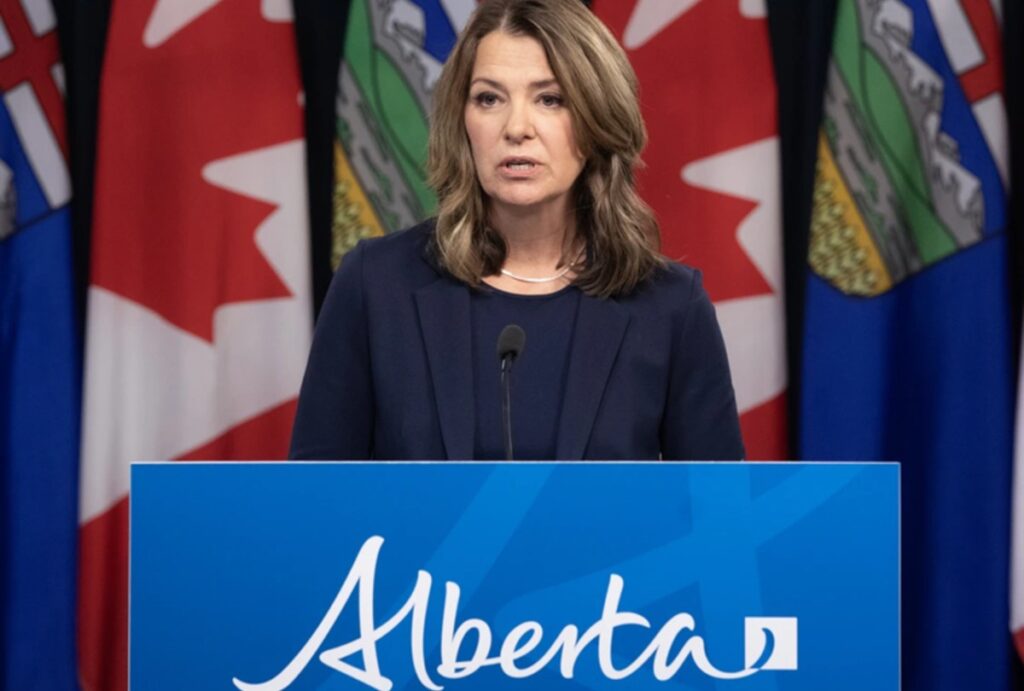 danielle smith podium alberta sign 1200x810