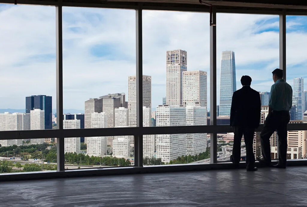 businessmen talking over a view 1200x810