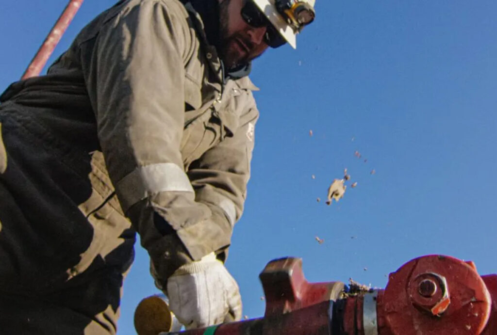 istock oilfield worker pumps down lines 1200x810